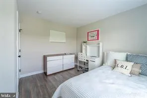 a bedroom with a bed and a desk
