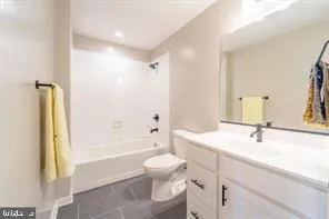 a bathroom with a sink a toilet and a bathtub