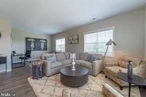 a living room with furniture and a window
