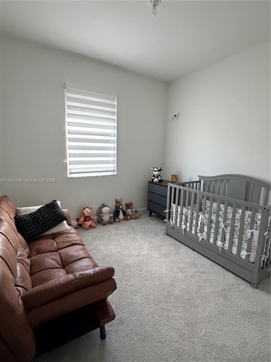 14872 Southwest 265th Street Homestead, FL 33032 - Photo 14 of 15 a living room with furniture and a couch