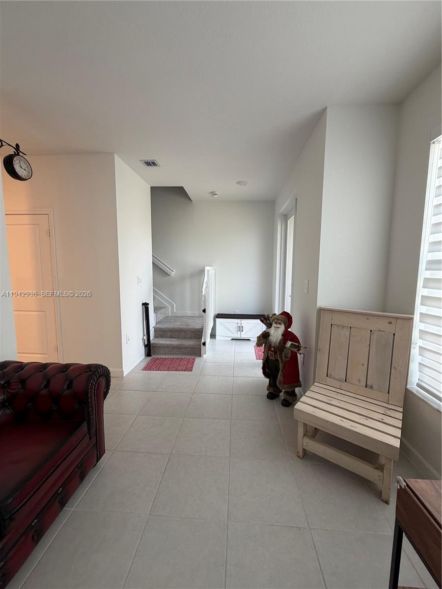 14872 Southwest 265th Street Homestead, FL 33032 - Photo 3 of 15 a living room with furniture and a couch