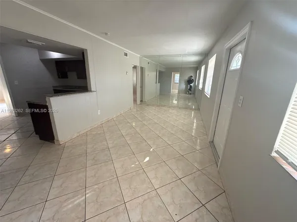 a view of hallway with stairs and a couch