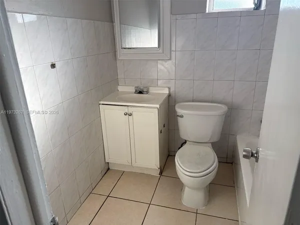 a bathroom with a toilet and a sink