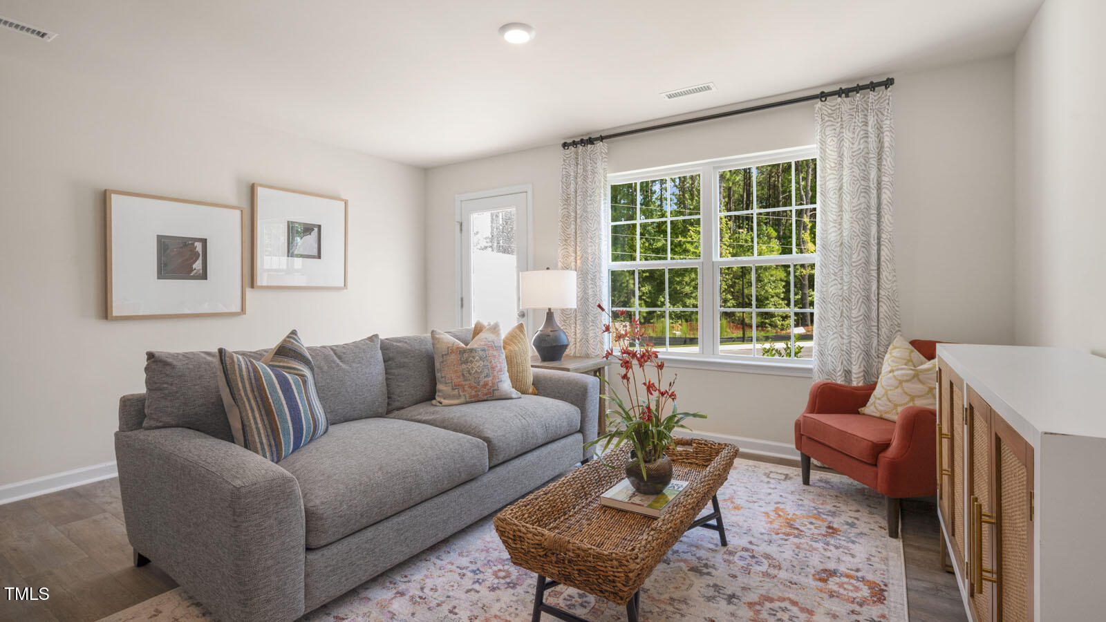 8537 Beckett Chase Way Raleigh, NC 27616 - Photo 16 of 32 a living room with furniture and a window
