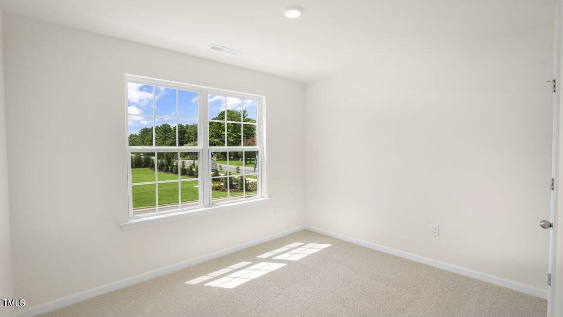 8537 Beckett Chase Way Raleigh, NC 27616 - Photo 26 of 32 a view of an empty room with a window