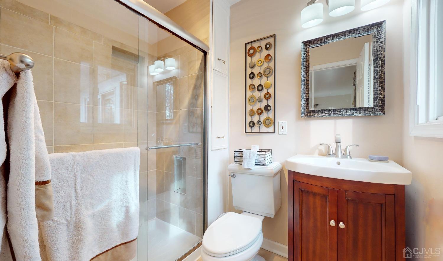 17 Timber Road Edison, NJ 08820 - Photo 14 of 37 a bathroom with a sink vanity mirror and toilet