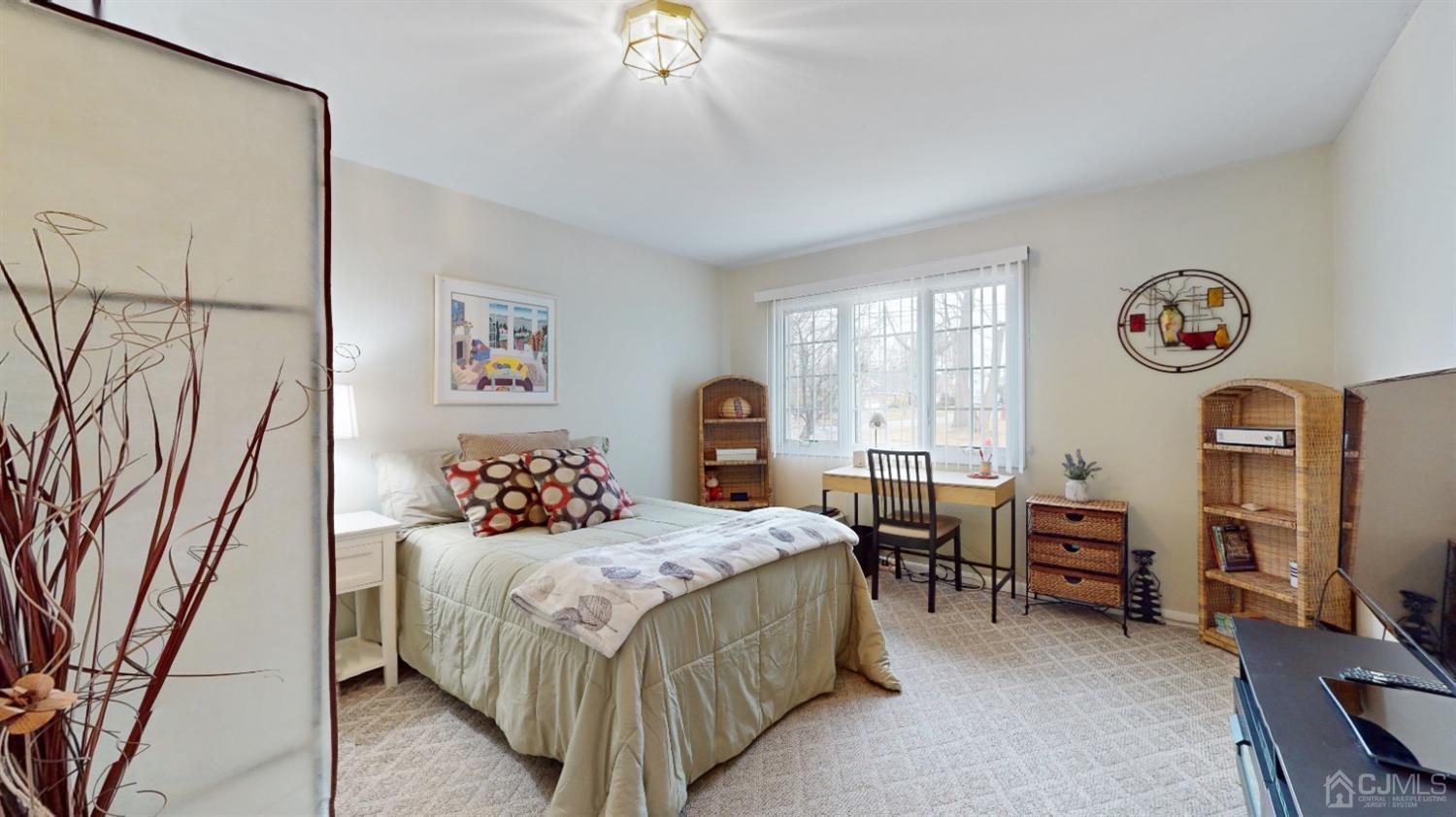 17 Timber Road Edison, NJ 08820 - Photo 15 of 37 a bedroom with a bed and a chandelier