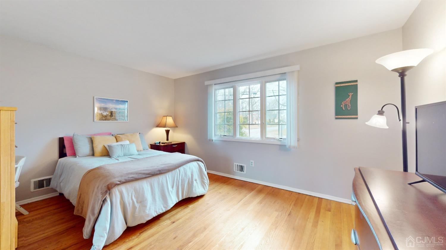 17 Timber Road Edison, NJ 08820 - Photo 16 of 37 a bedroom with a bed and a large window