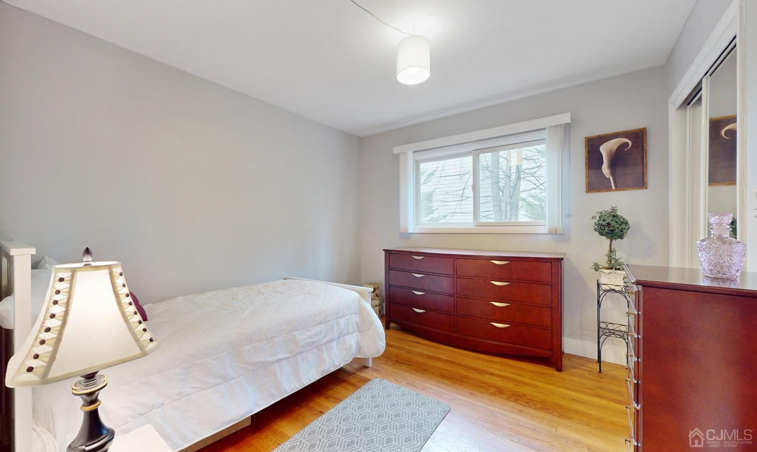 17 Timber Road Edison, NJ 08820 - Photo 18 of 37 a bedroom with a bed window and table