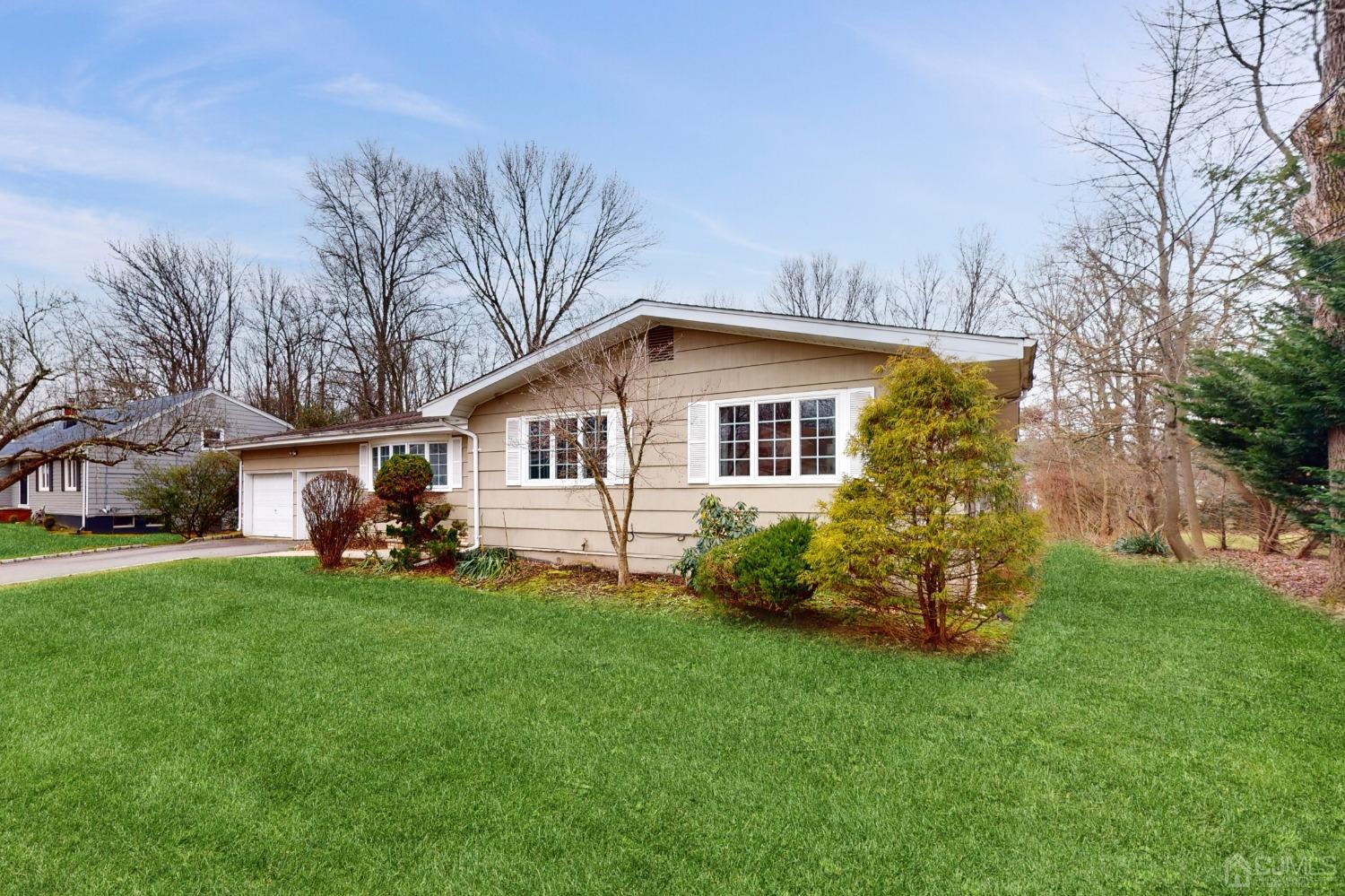 17 Timber Road Edison, NJ 08820 - Photo 2 of 37 a front view of a house with garden