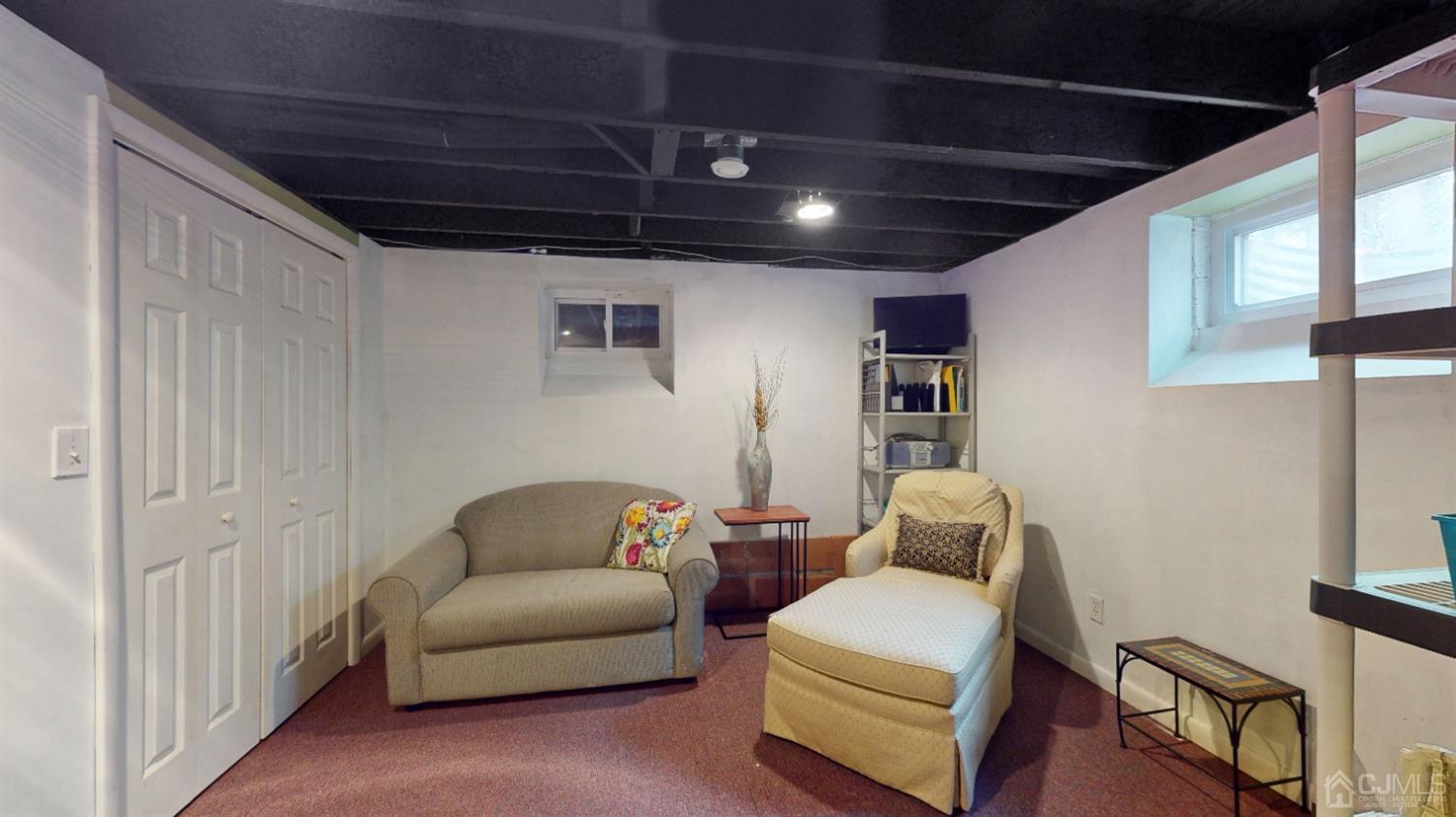 17 Timber Road Edison, NJ 08820 - Photo 23 of 37 a living room with furniture and a couch