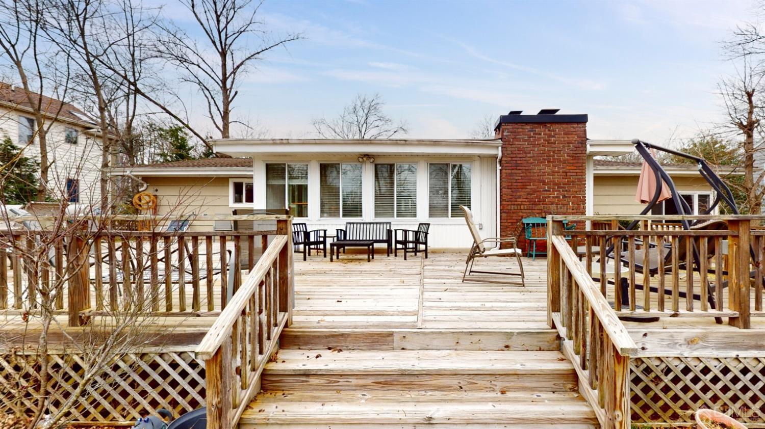 17 Timber Road Edison, NJ 08820 - Photo 30 of 37 a view of a house with wooden deck and furniture