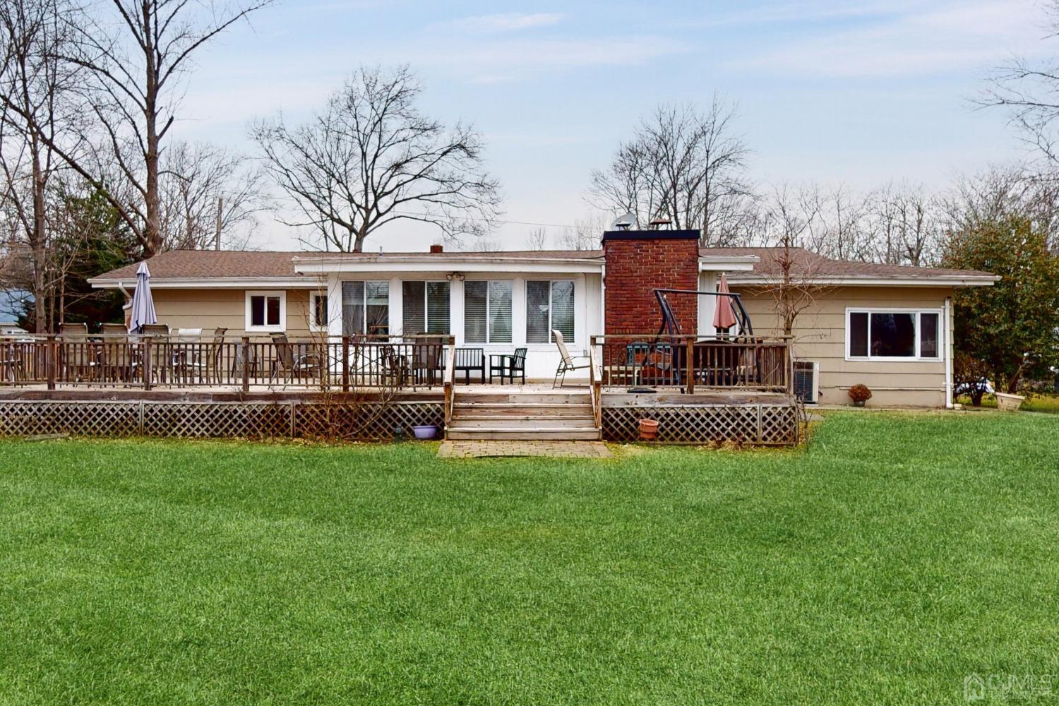 17 Timber Road Edison, NJ 08820 - Photo 31 of 37 a front view of house with yard and seating area