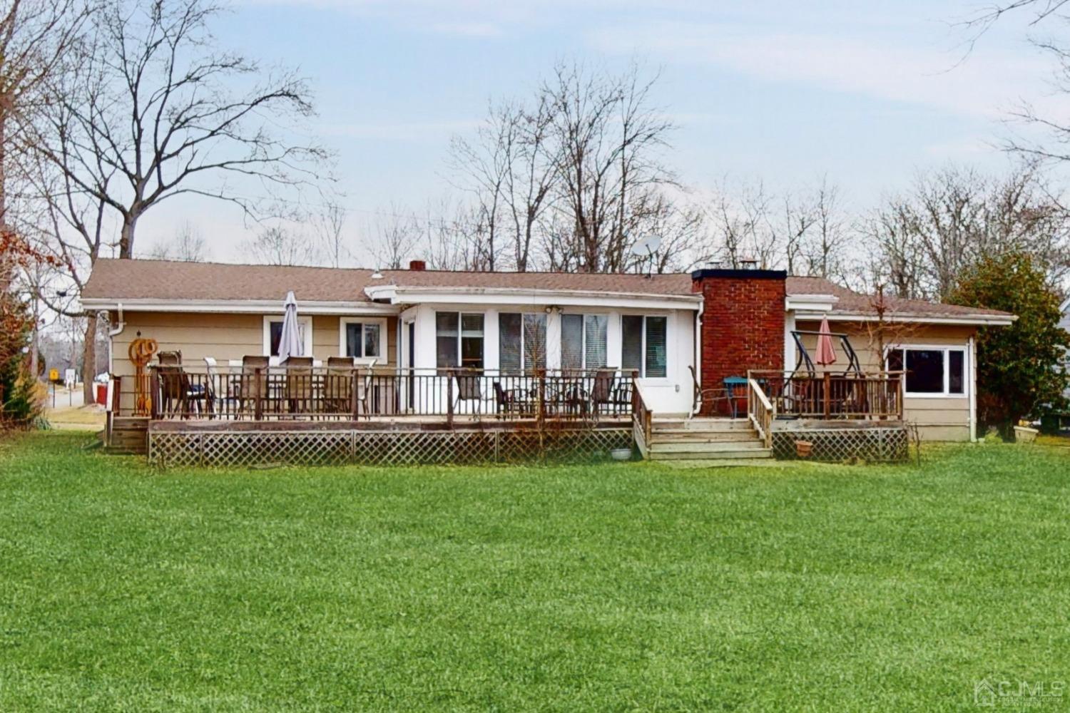 17 Timber Road Edison, NJ 08820 - Photo 32 of 37 a front view of a house with a garden and trees
