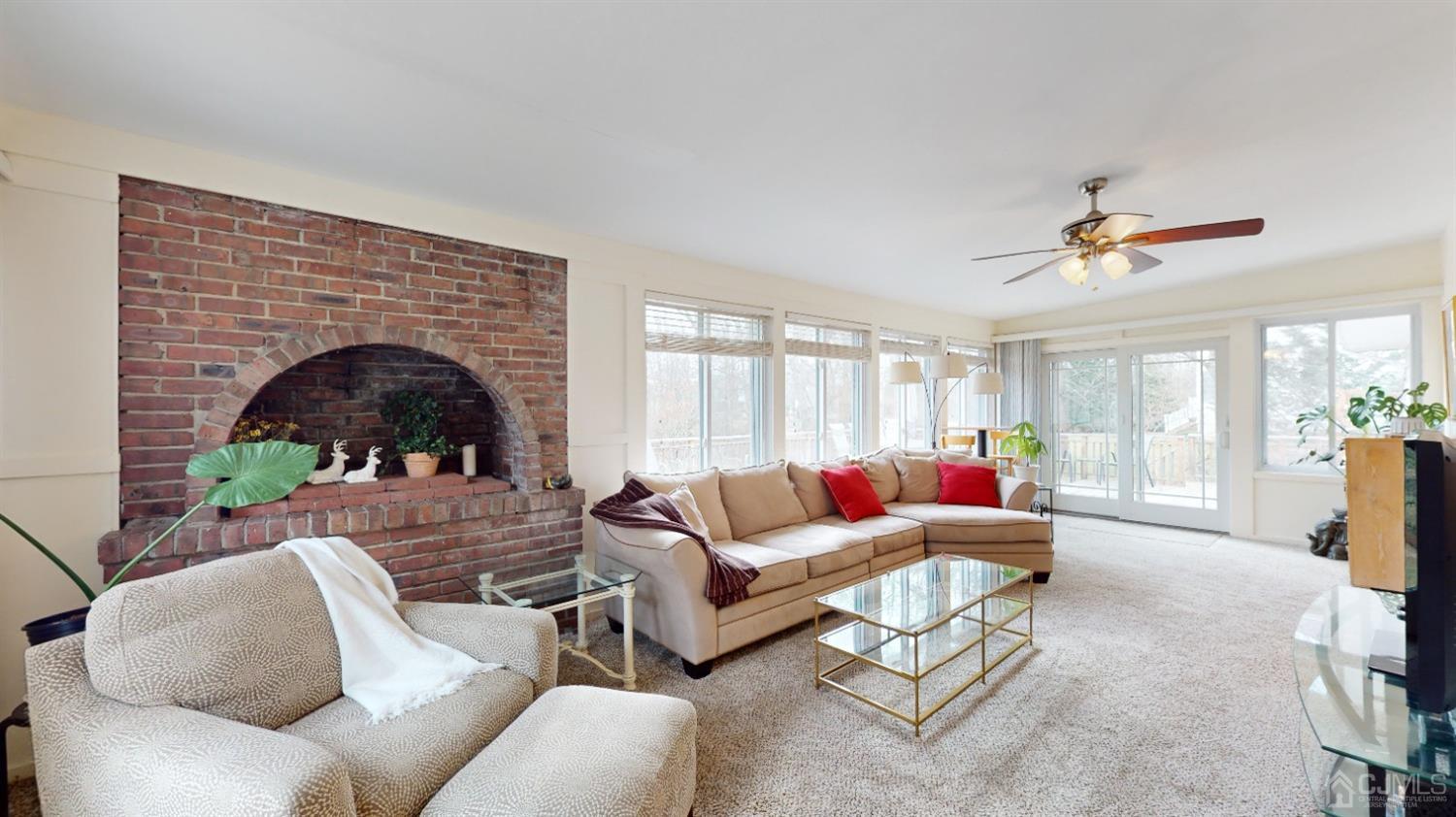 17 Timber Road Edison, NJ 08820 - Photo 4 of 37 a living room with furniture and a fireplace