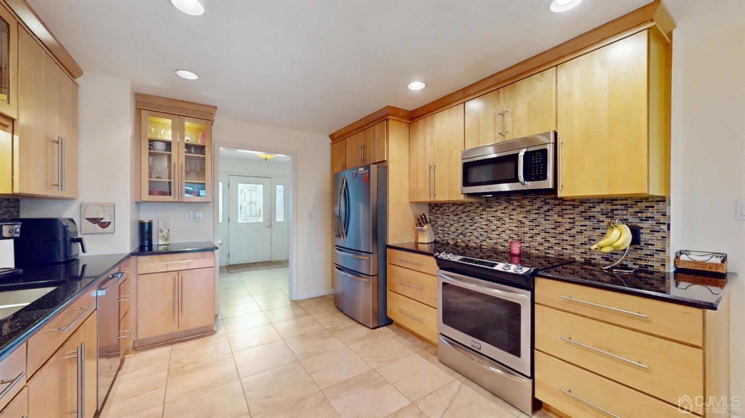 17 Timber Road Edison, NJ 08820 - Photo 8 of 37 a kitchen with stainless steel appliances granite countertop a refrigerator and a stove