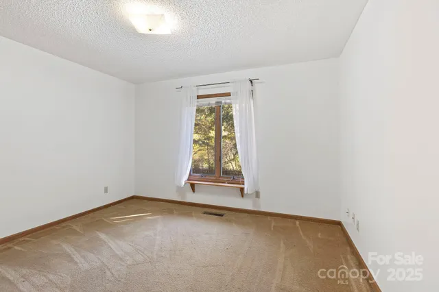 an empty room with window