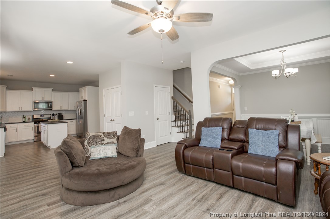 474 Kerr Lake Road Aberdeen, NC 28315 - Photo 11 of 47 a living room with furniture and a view of kitchen