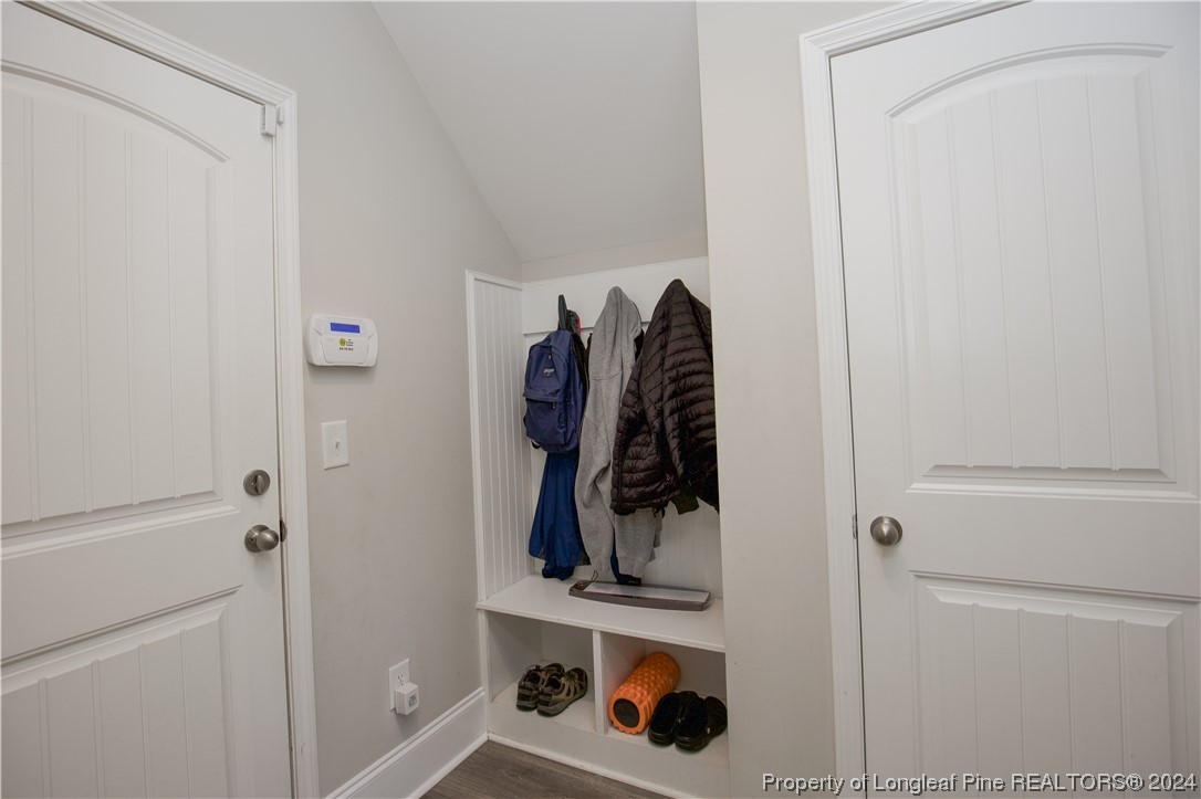 474 Kerr Lake Road Aberdeen, NC 28315 - Photo 18 of 47 a view of walk in closet with clothes and shoes