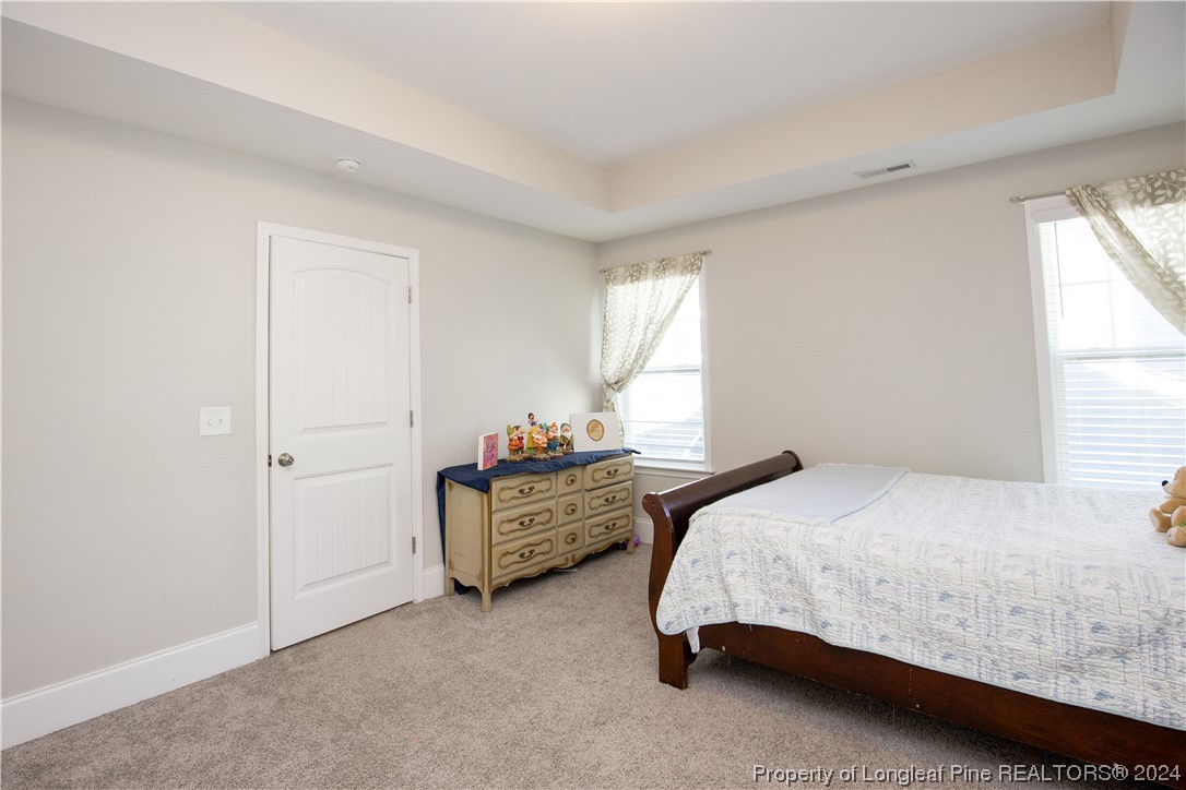 474 Kerr Lake Road Aberdeen, NC 28315 - Photo 23 of 47 a bedroom with two bed and a window