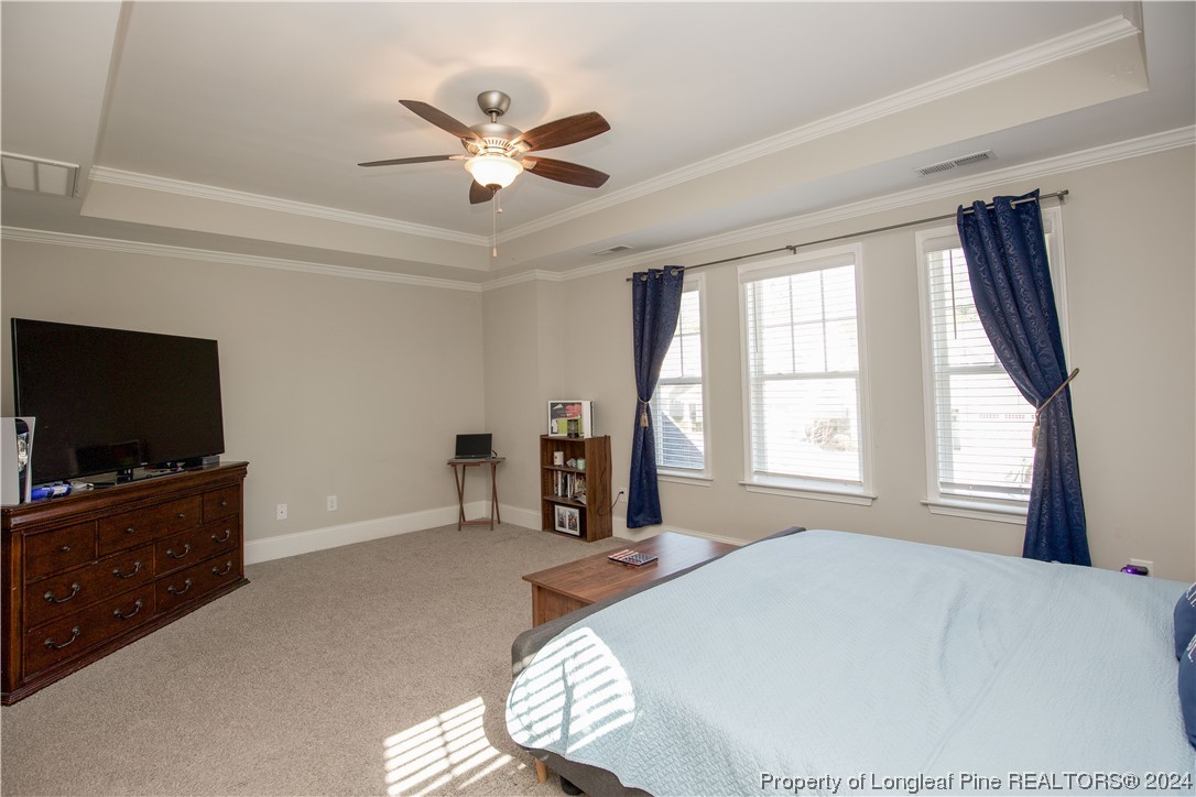 474 Kerr Lake Road Aberdeen, NC 28315 - Photo 31 of 47 a bedroom with a bed and a flat screen tv