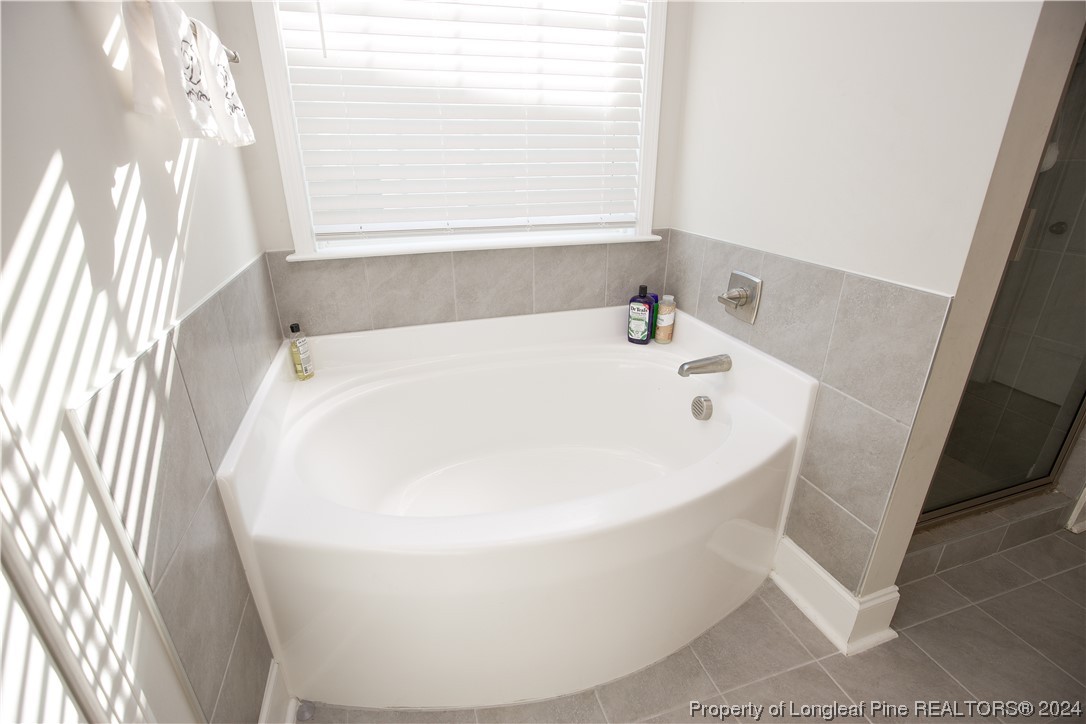 474 Kerr Lake Road Aberdeen, NC 28315 - Photo 33 of 47 a white bath tub sitting in a bathroom