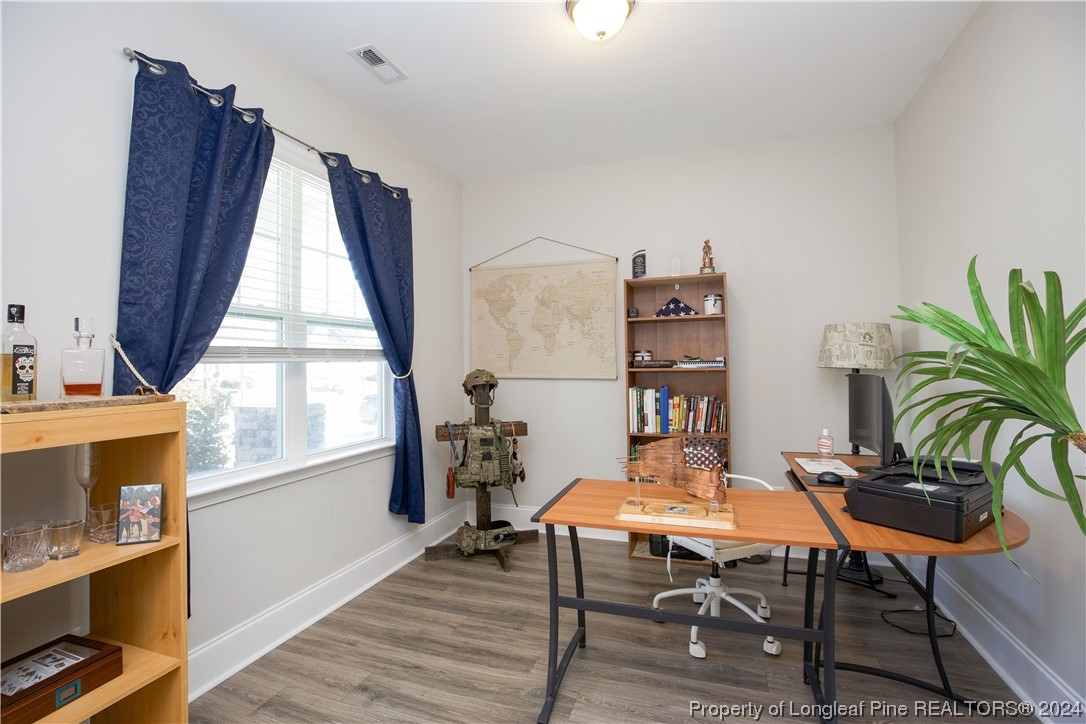 474 Kerr Lake Road Aberdeen, NC 28315 - Photo 5 of 47 a dining room with furniture and window