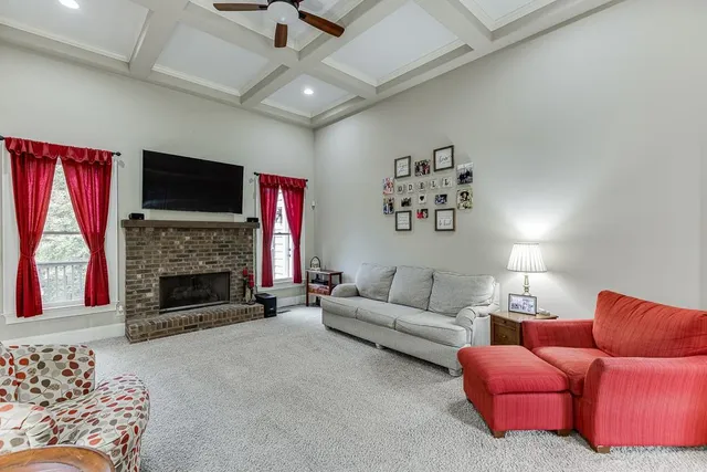 a kitchen with stainless steel appliances granite countertop a refrigerator a sink dishwasher stove and oven