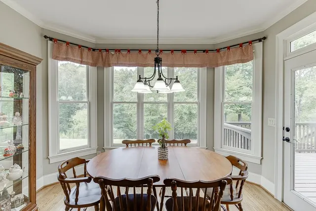 a bedroom with furniture and a flat screen tv