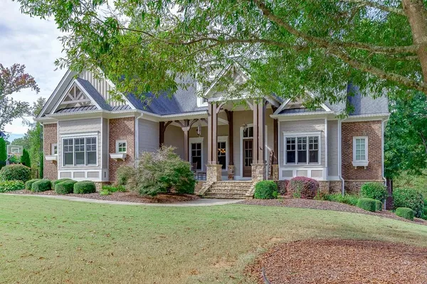 a front view of a house with a yard