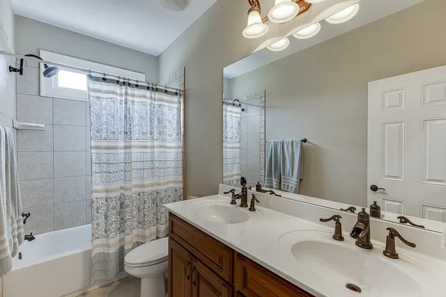 a kitchen with stainless steel appliances granite countertop a refrigerator stove a sink dishwasher and microwave oven