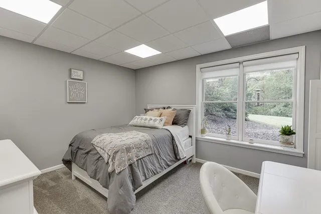 an aerial view of a house with garden space and trees