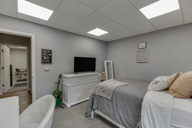 an aerial view of a house with swimming pool garden and patio