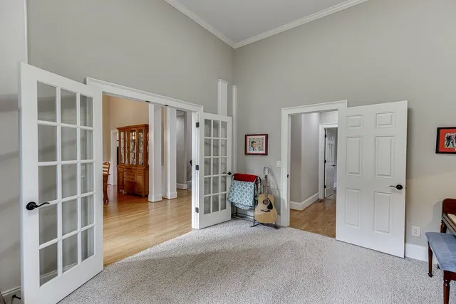 a living room with furniture fireplace and a window