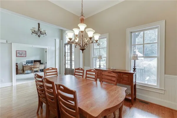 a kitchen with stainless steel appliances granite countertop a sink a stove and a refrigerator