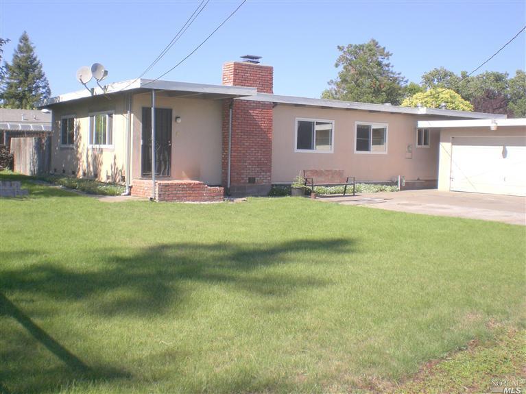 143 Fleming Way Santa Rosa, CA 95407 - Photo 1 of 1 a view of a house with a yard and a garage