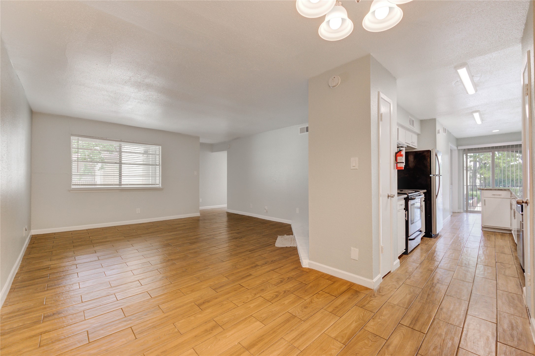 6200 West Tidwell Road, Unit 2608 Houston, TX 77092 - Photo 13 of 17 a view of a room with wooden floor and stairs