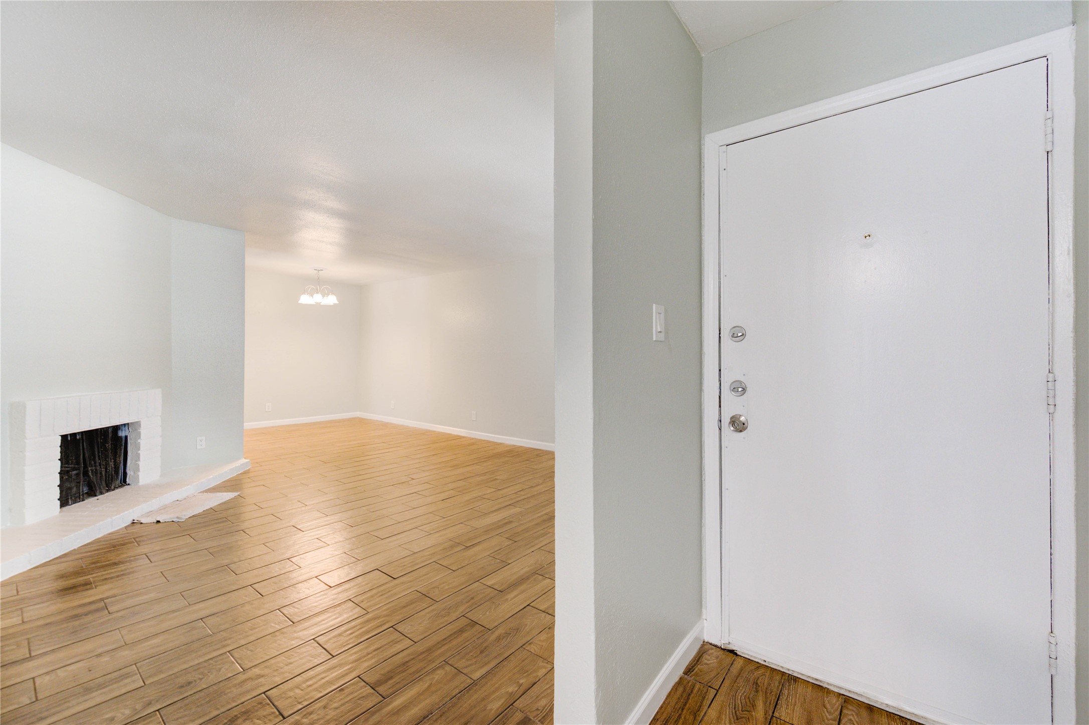 6200 West Tidwell Road, Unit 2608 Houston, TX 77092 - Photo 3 of 17 a view of empty room with wooden floor