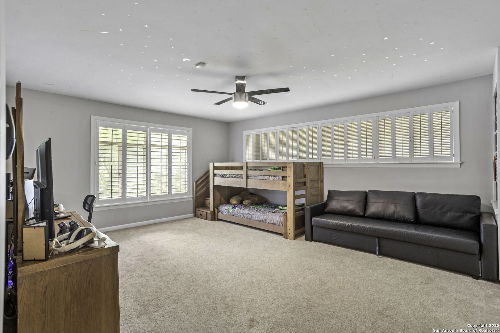 906 East Cedar Street Seguin, TX 78155 - Photo 12 of 17 a living room with furniture and a flat screen tv