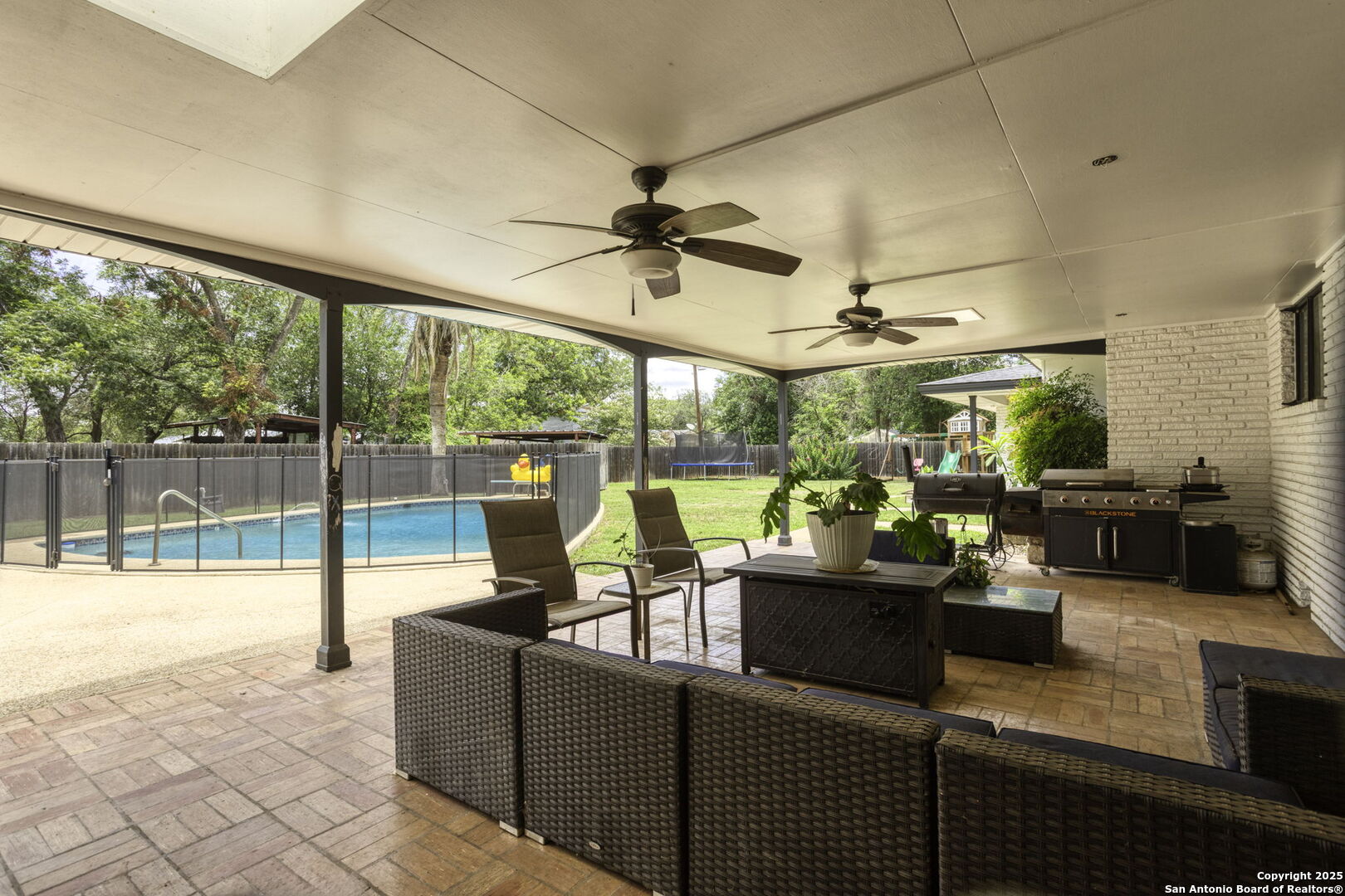 906 East Cedar Street Seguin, TX 78155 - Photo 15 of 17 a living room with furniture and a floor to ceiling window