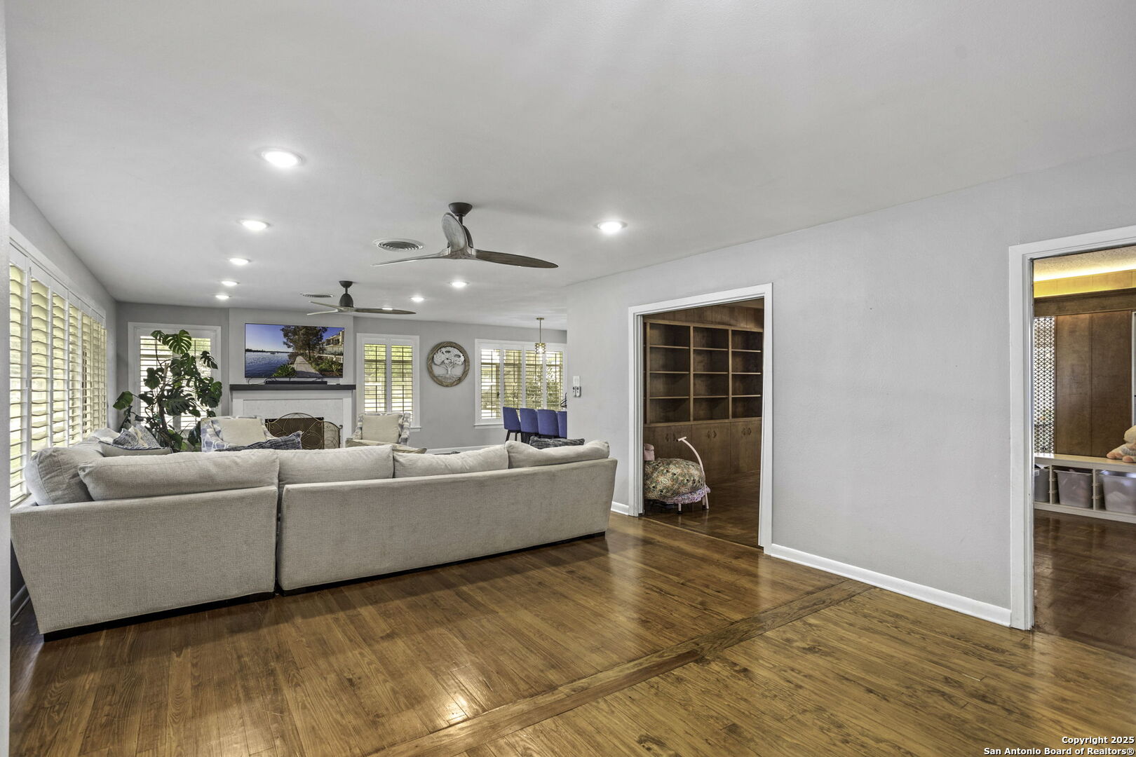 906 East Cedar Street Seguin, TX 78155 - Photo 3 of 17 a living room with furniture and a fireplace