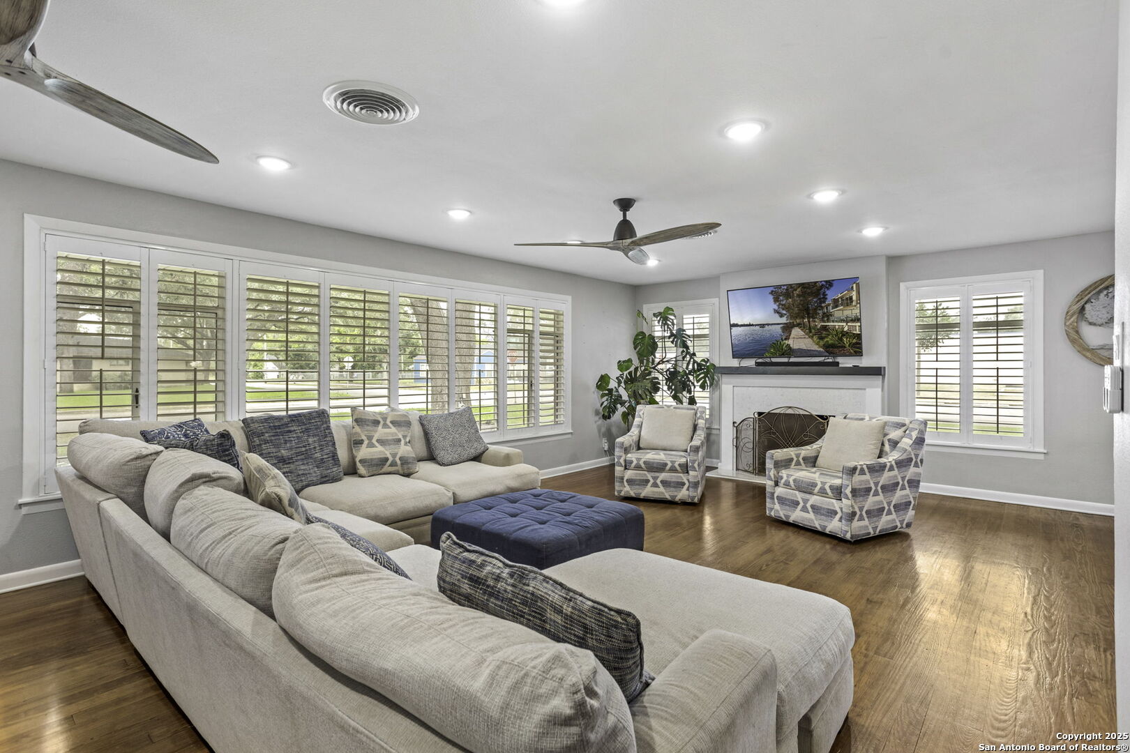 906 East Cedar Street Seguin, TX 78155 - Photo 4 of 17 a living room with fireplace furniture and a large window