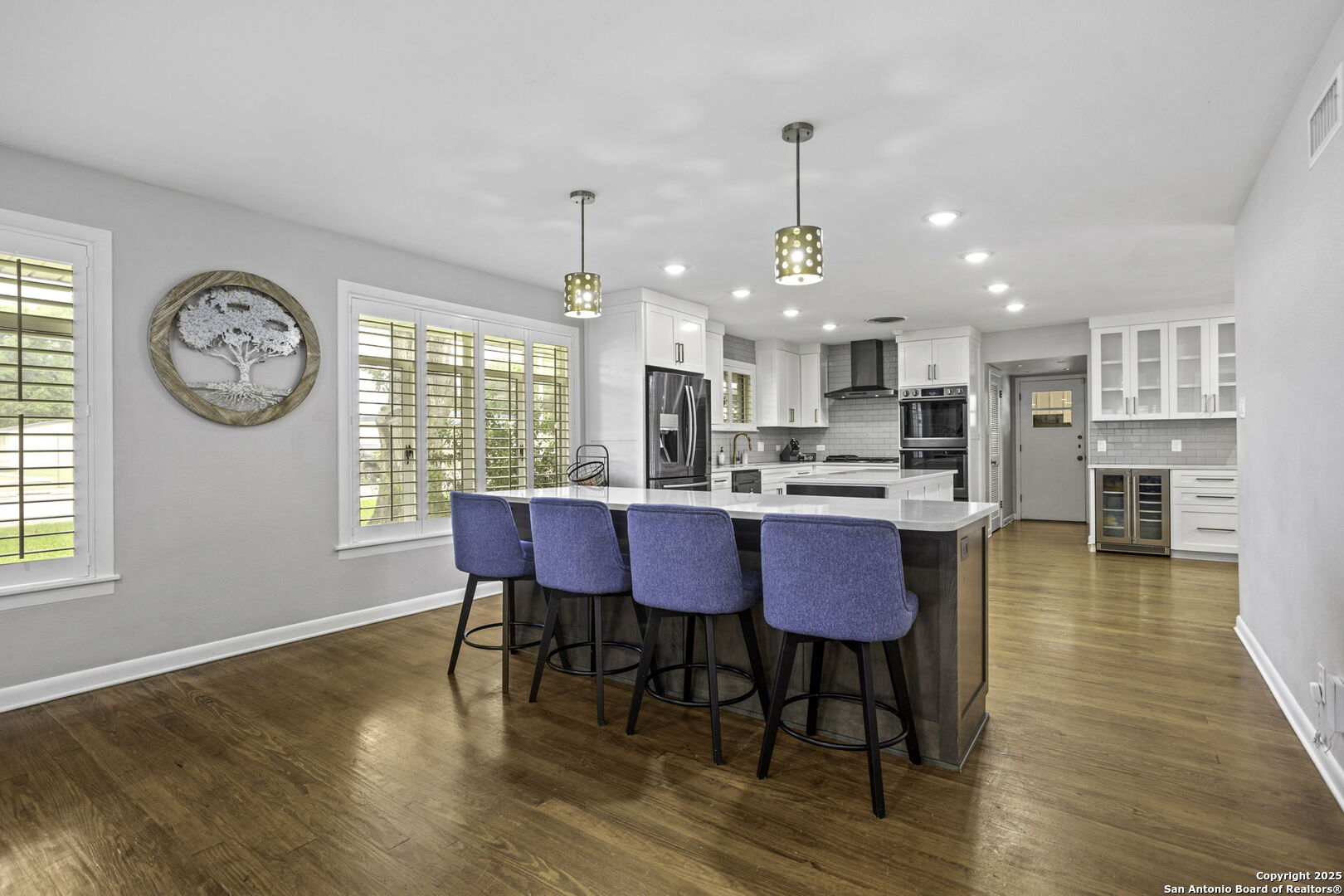906 East Cedar Street Seguin, TX 78155 - Photo 5 of 17 a view of a dining room with furniture window and wooden floor