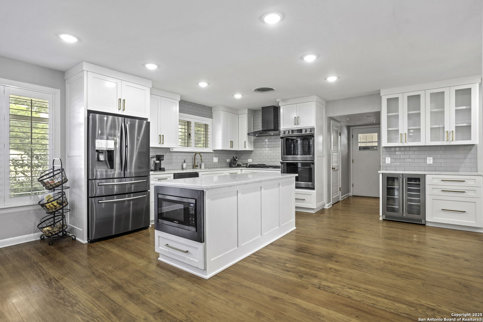 906 East Cedar Street Seguin, TX 78155 - Photo 10 of 22 a kitchen with a refrigerator and a stove top oven