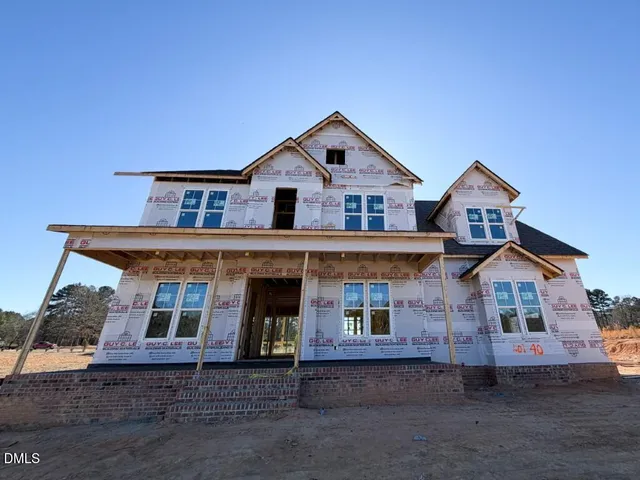a front view of a house with yard