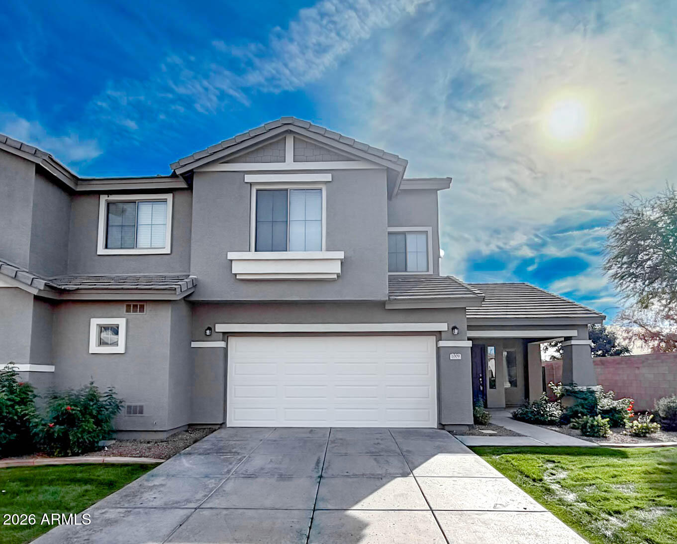 a front view of a house with a yard