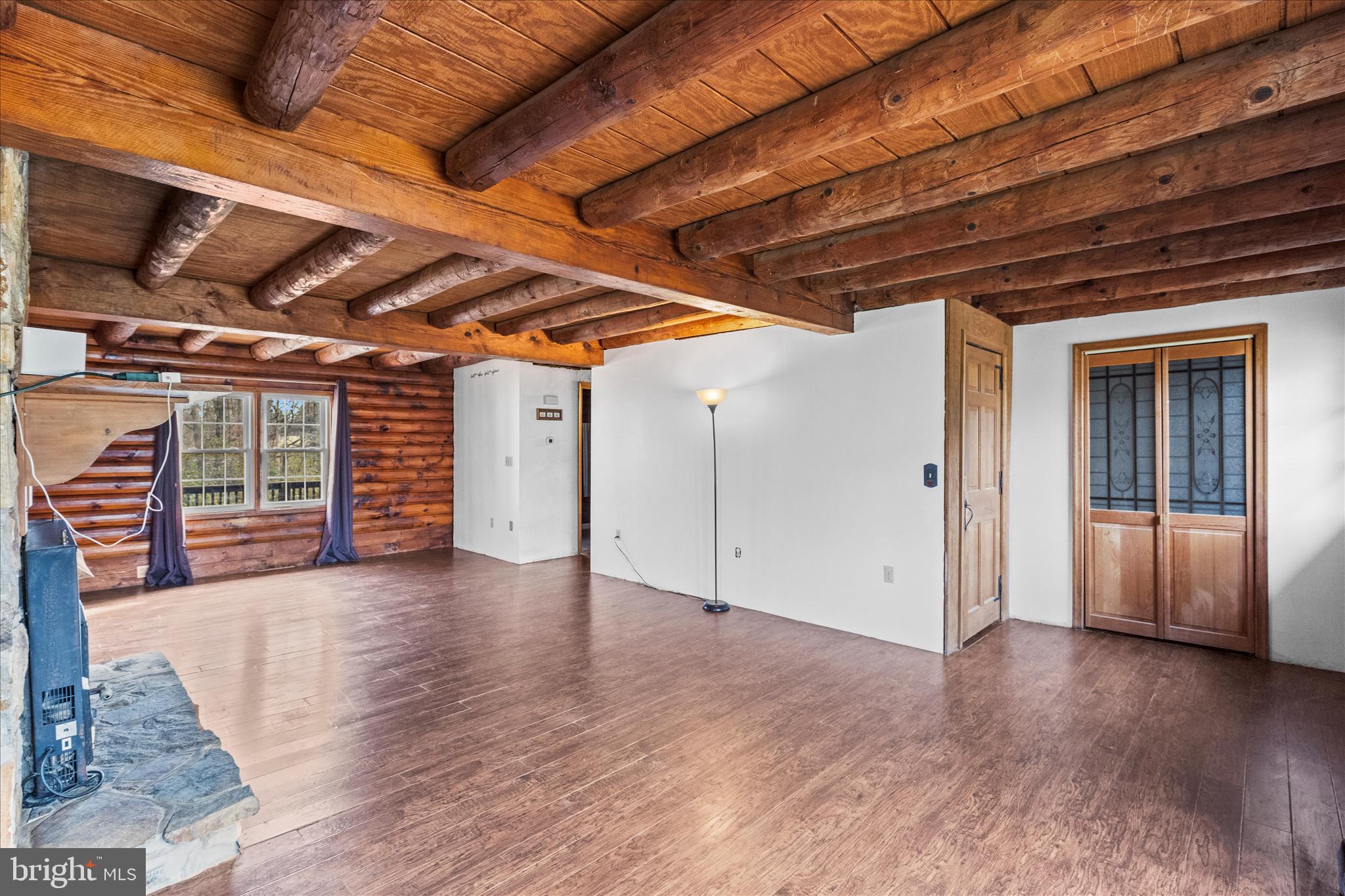 181 Gooseville Road New Oxford, PA 17350 - Photo 12 of 45 an empty room with wooden floor and windows