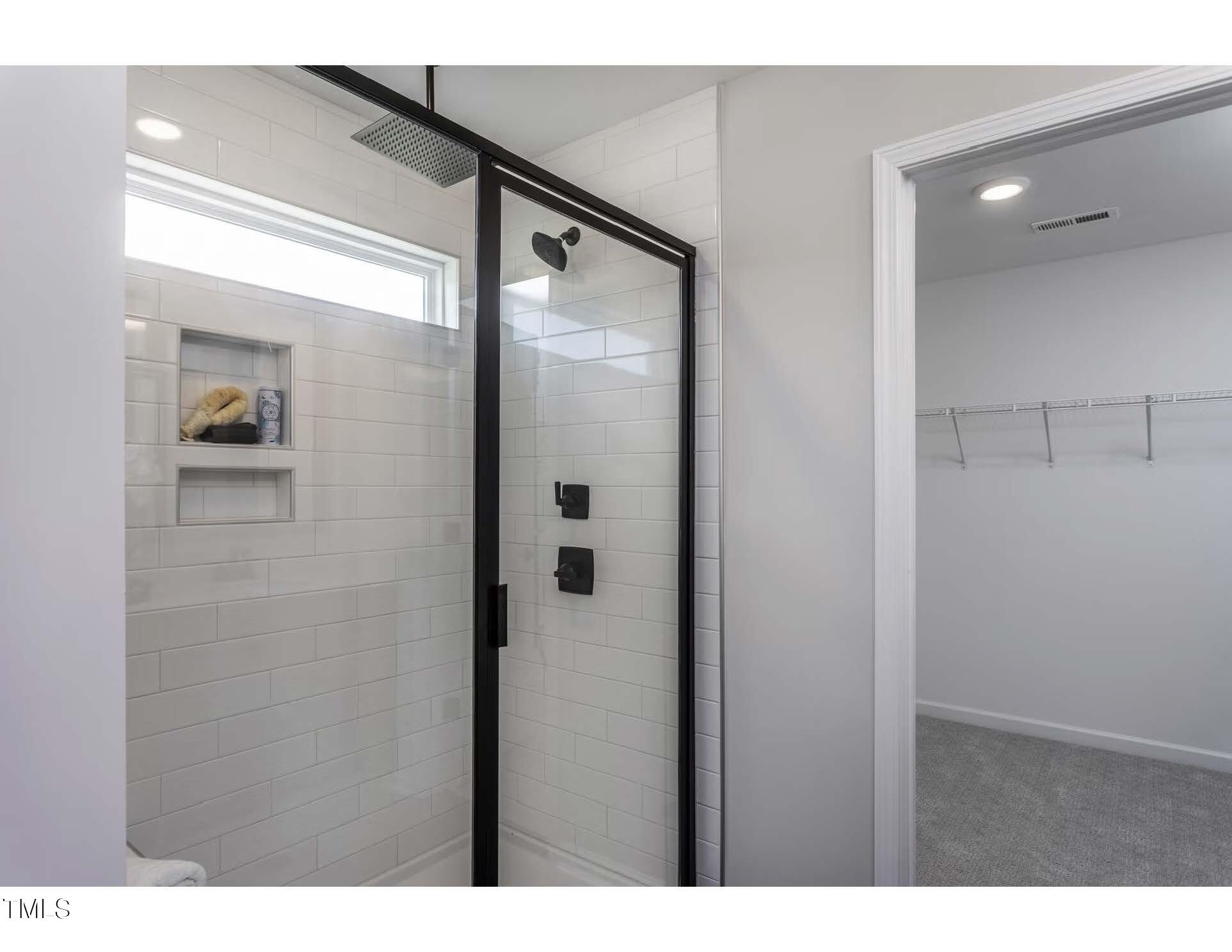 272 White Azalea Way Benson, NC 27504 - Photo 12 of 24 a bathroom with a shower and a sink
