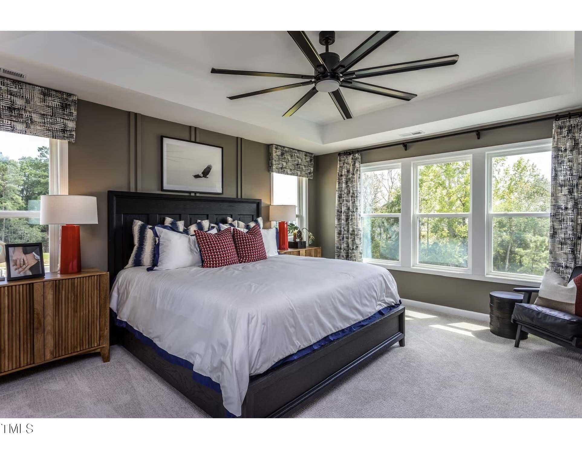 272 White Azalea Way Benson, NC 27504 - Photo 10 of 24 a bedroom with a large bed and a window