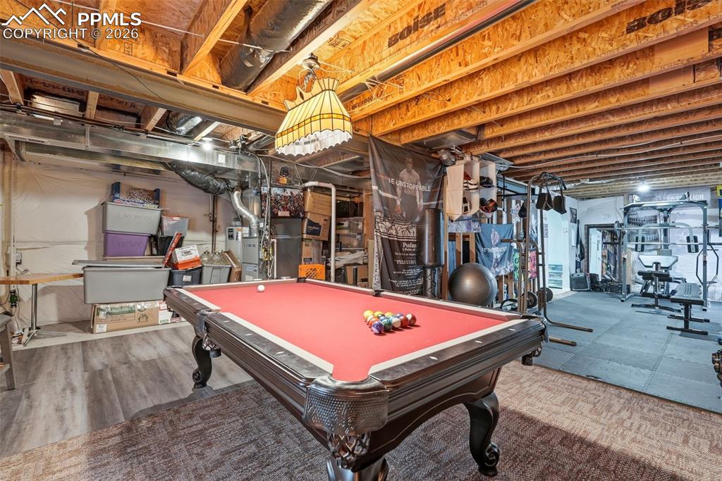 6907 Shimmering Leaf Road Colorado Springs, CO 80908 - Photo 24 of 49 a room with pool table and a table